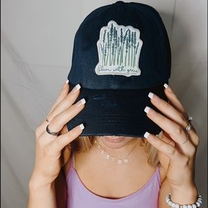 Navy hat + bloom with grace 🌱